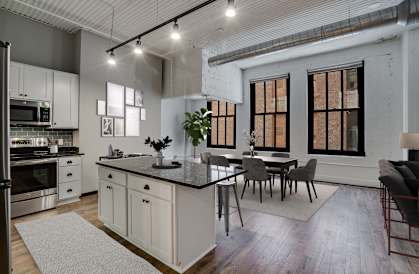 Spacious Living Area With Wood-Style Flooring
