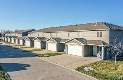 a row of houses with garages