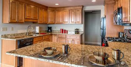 a kitchen with wooden cabinets and granite countertopsat Monroeville Apartments, Pennslyvania, 15146