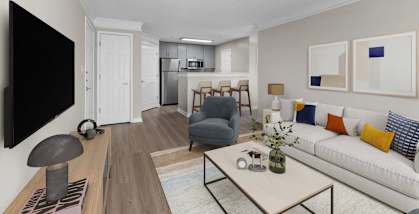 A modern living room with a white couch and a flat screen TV on the wall.