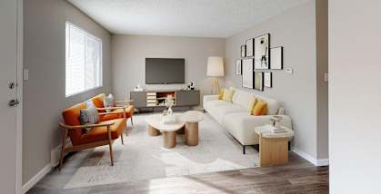 A living room with a white couch, a wooden chair, and a television.