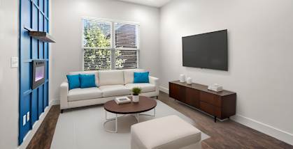 A modern living room with a white couch, a brown coffee table, and a flat-screen TV mounted on the wall.