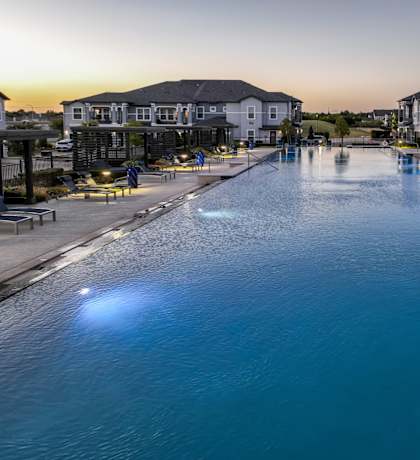resort-inspired swimming pool at Reveal on the Lake apartments