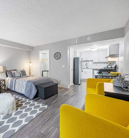 a living room with a couch and a bed
