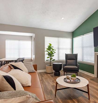 a living room with a couch and a fireplace at The Annaline, Nashville, Tennessee