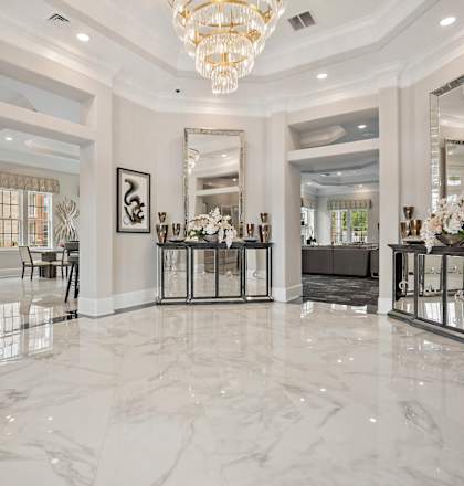 A large, elegant room with marble floors and a chandelier at Ellis Station, Durham, NC, 27703