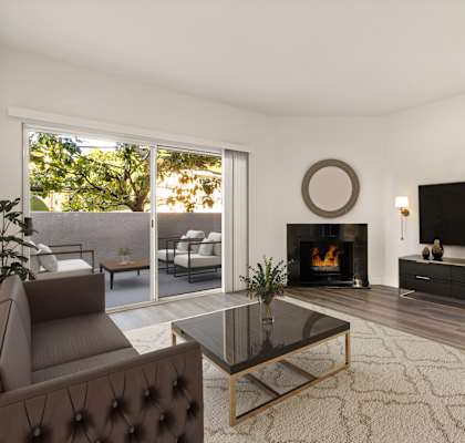 A modern living room with a fireplace and a flat screen TV.