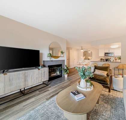 a living room with a large tv and a fireplace  at Citrine Hills, Ontario
