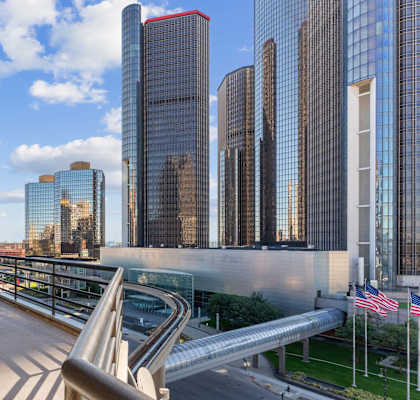 A cityscape with tall buildings and a clear sky.