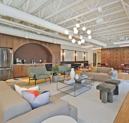 a living room with couches and chairs and a table