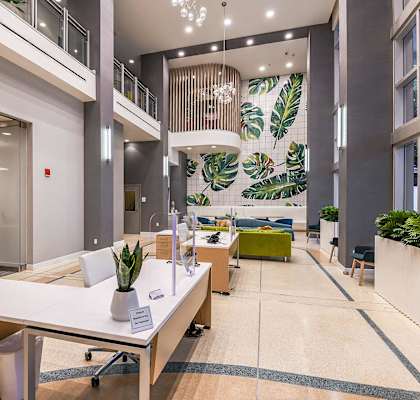 a large lobby with a table and chairs at Paramount on Lake Eola, Orlando, FL