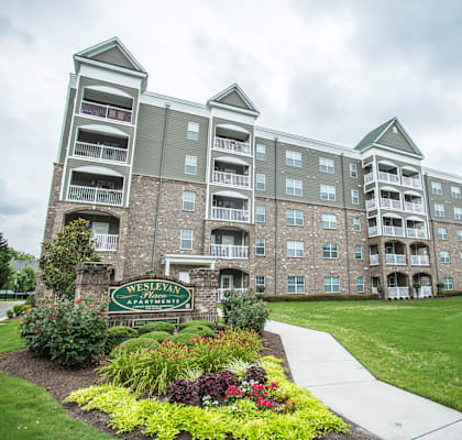 A large apartment complex with a sign that says "Overlea West".