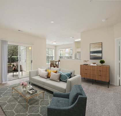 Model Unit living room with a white couch and a coffee table located in Manassas.