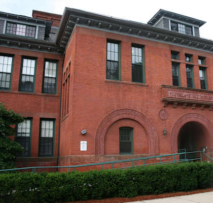 A red brick building with a sign that says "Columbia University".