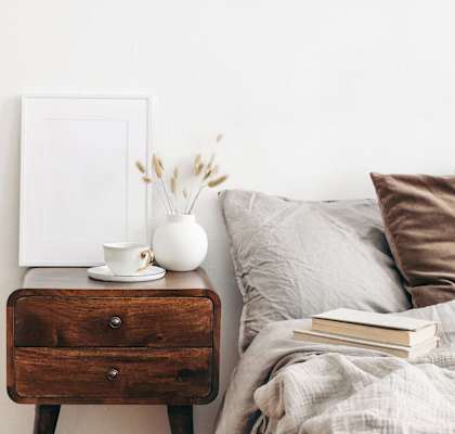 Model Bedroom and Cup of Coffee on Nightstand