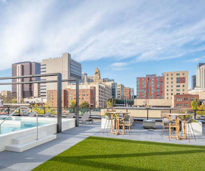 a field of grass in front of a building at Maven on Broadway, Rochester, MN, 55904