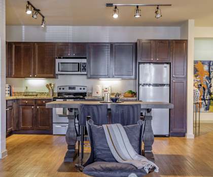 spacious kitchen with stainless steel appliances at The Pradera apartments