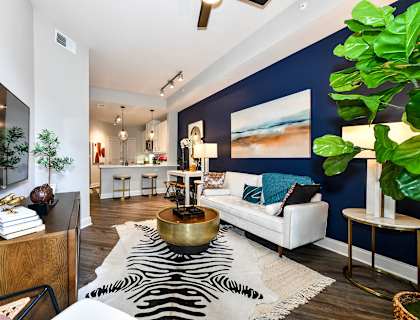 a living room with a blue accent wall