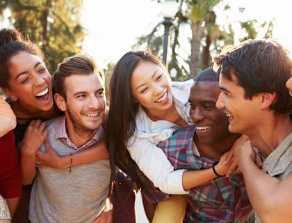 a group of people hugging and smiling