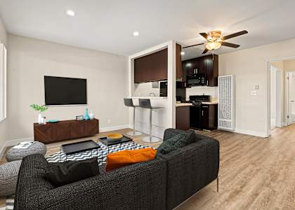 a living room with a couch and a tv