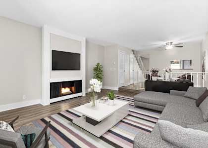 a living room with a fireplace and couches
