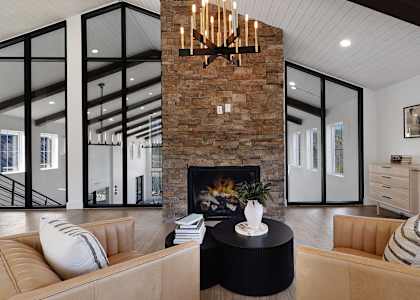 A living room with a fireplace and a couch.