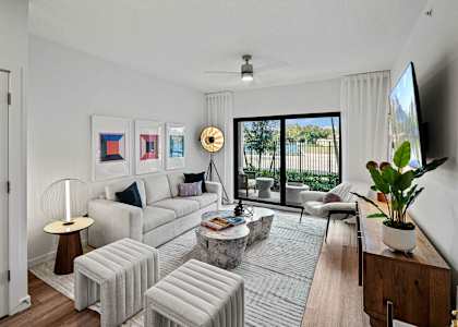 a living room with white furniture and a large window at Altis Grand Kendall, Florida, 33186