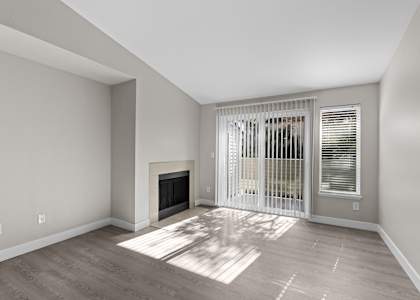 The Marina at Martha Lake Apartments in Bothell, Washington Living Room with Fireplace and Private Patio