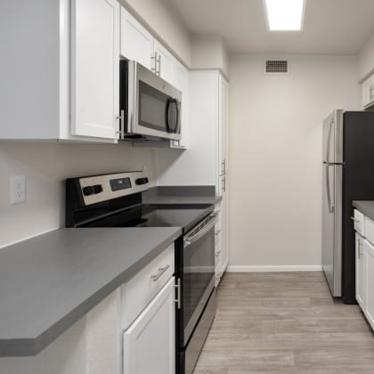 apartment kitchen with stainless steel appliances at Paseo 51, Glendale, 85302