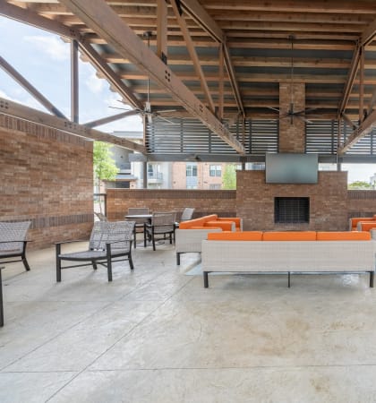 a large open space with couches and chairs and a fireplace