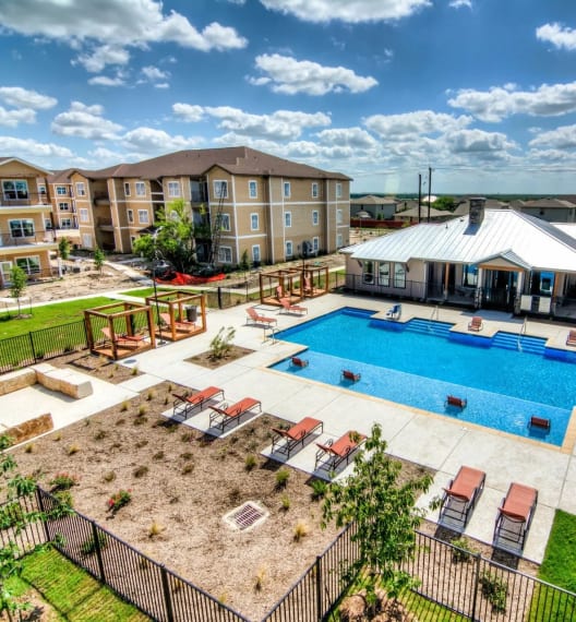 take a dip in our resort style pool at Villa Espada Apartments, San Antonio, Texas
