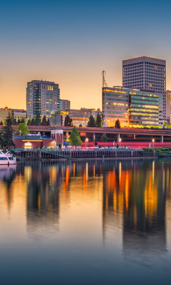 a view of the portland city skyline at dusk