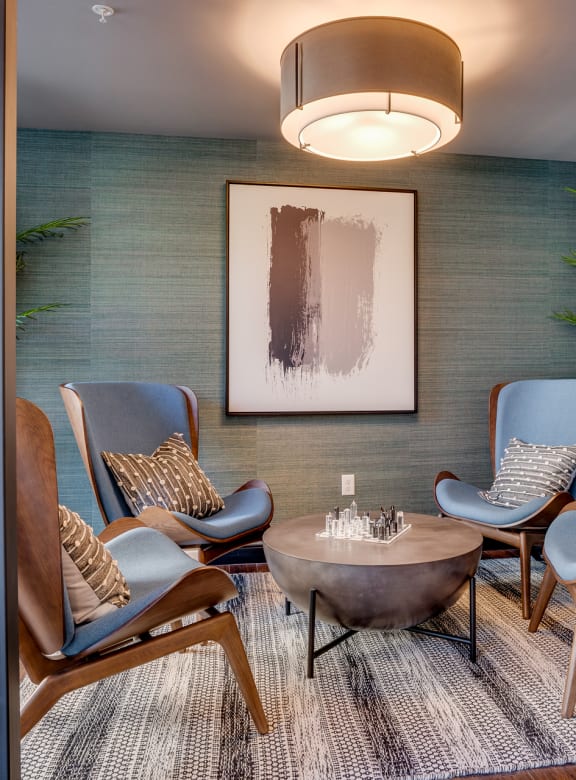 a living room with chairs and a table at Marquee, Minnesota