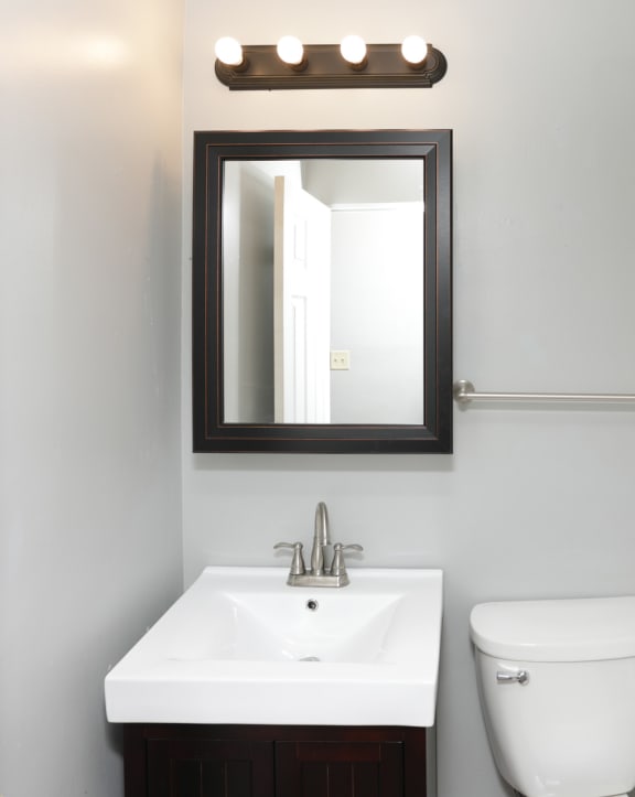 a small bathroom with a sink toilet and shower