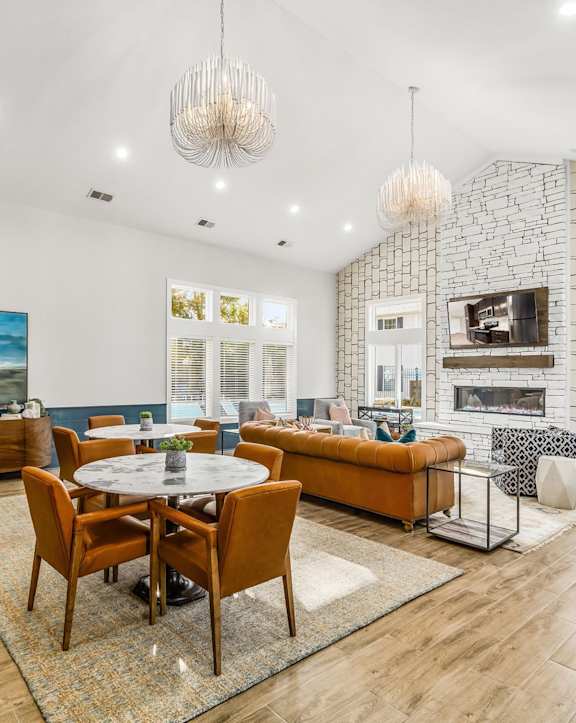 an outdoor kitchen with stainless steel appliances and bar stools
