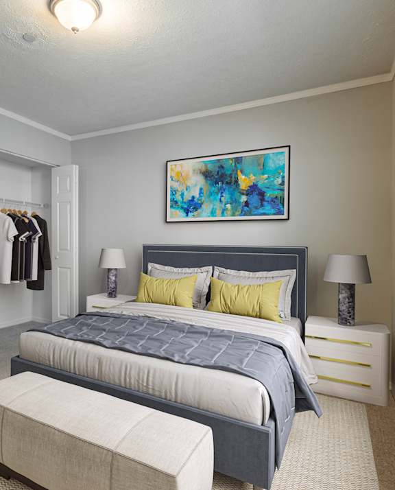 a bedroom with a large bed and a walk in closet