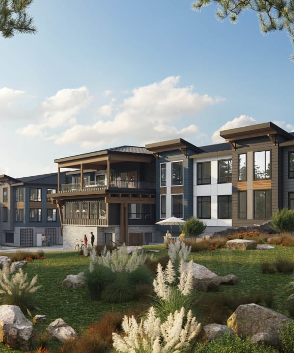 a rendering of a large apartment complex with a pond in the foreground and trees in the background