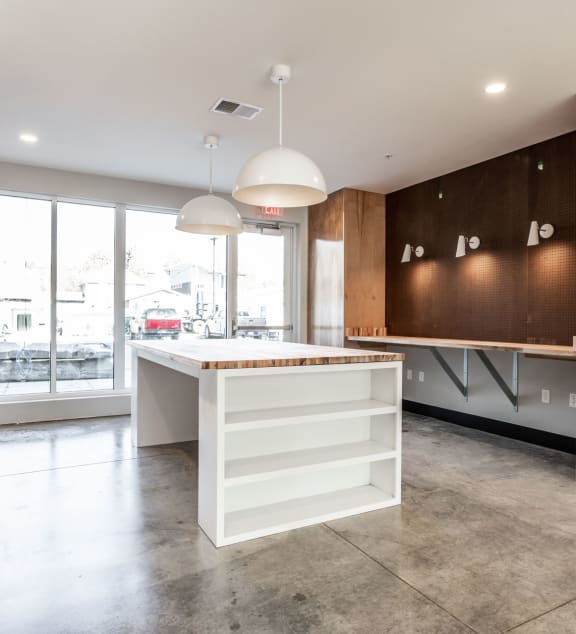 a large kitchen with a white island and wooden cabinets at Edge 35, Indianapolis, IN, 46203