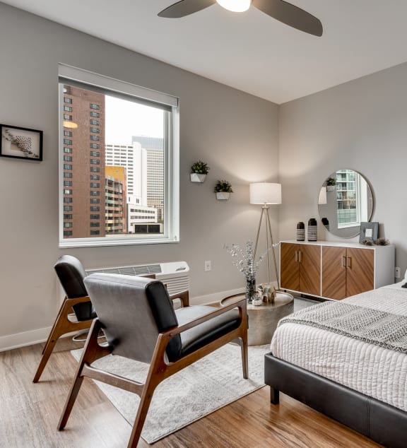a bedroom with a large bed and a window at Marquee, Minnesota