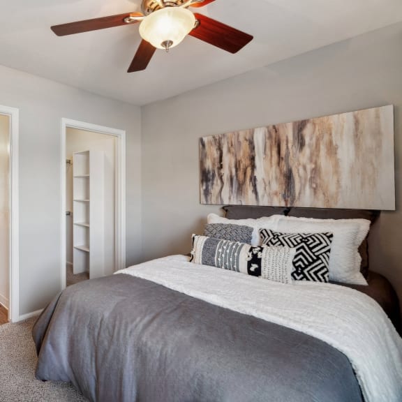 luxury bedroom with a ceiling fan at Dakota Ridge luxury Littleton, CO apartments