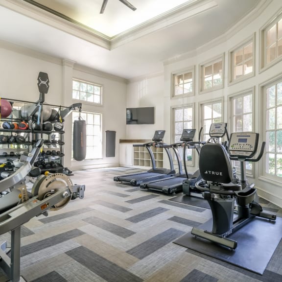 fitness center with free weights at Stoneleigh on Spring Creek apartments