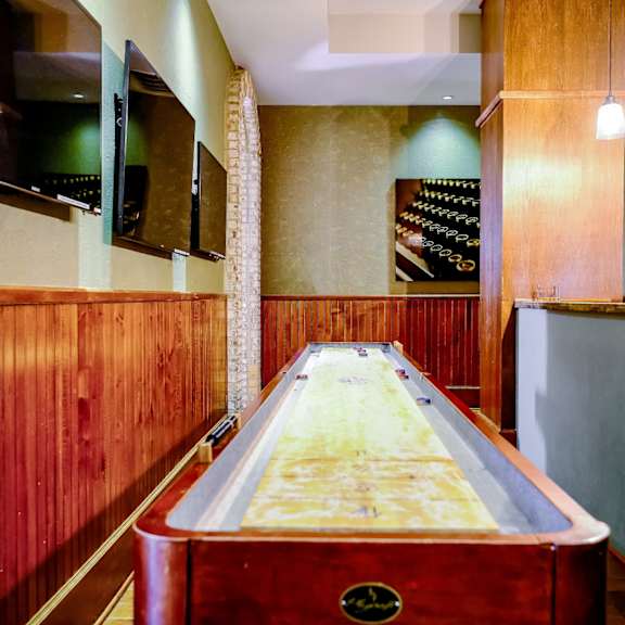 game room with shuffle board at Berkshire Village District apartments