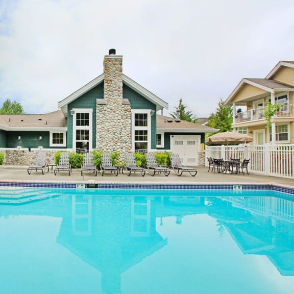 pool and lounge chairs at Echo Ridge Apartments in Snoqualmie, WA 98065