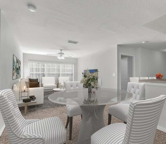 A modern dining room with a glass table and striped chairs. at The Villages on Millenia Apartments, Orlando, FL, 32839