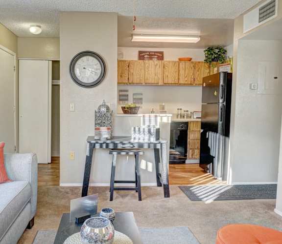 A living room with a grey couch and a coffee table.