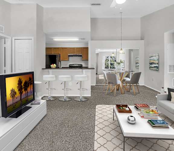 our apartments offer a living room with a couch a coffee table and a flat screen tv