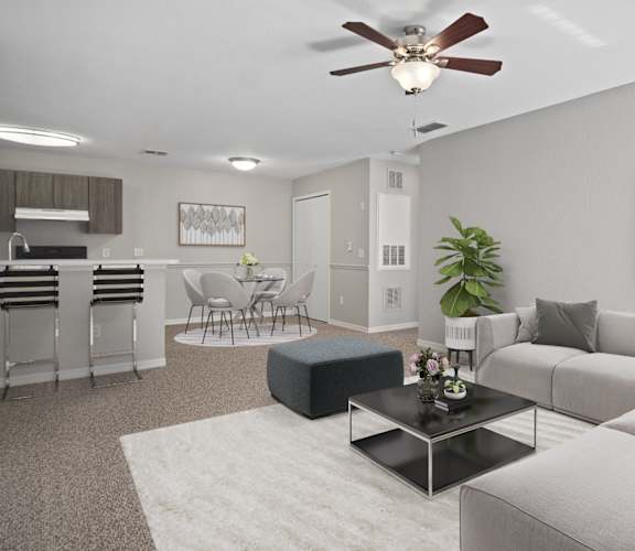 our apartments offer a living room with a couch a coffee table and a kitchen with a bar