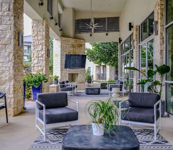 outdoor living area with comfortable seating at The Allure apartments
