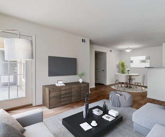 a living room with a couch and a table and a television at Lakecrest Village, Houston