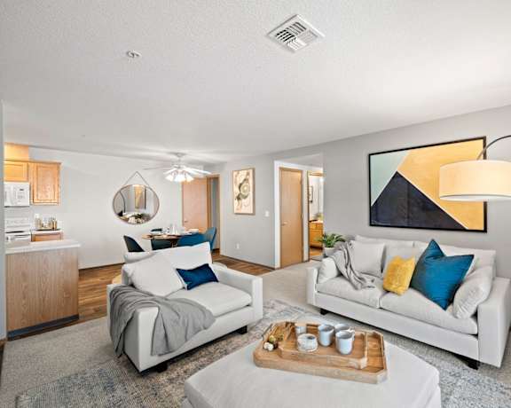 a living room with two couches and a table